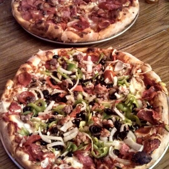 Photo taken at Napoli Pizzeria &amp; Italian Food by Chris on 4/28/2013
