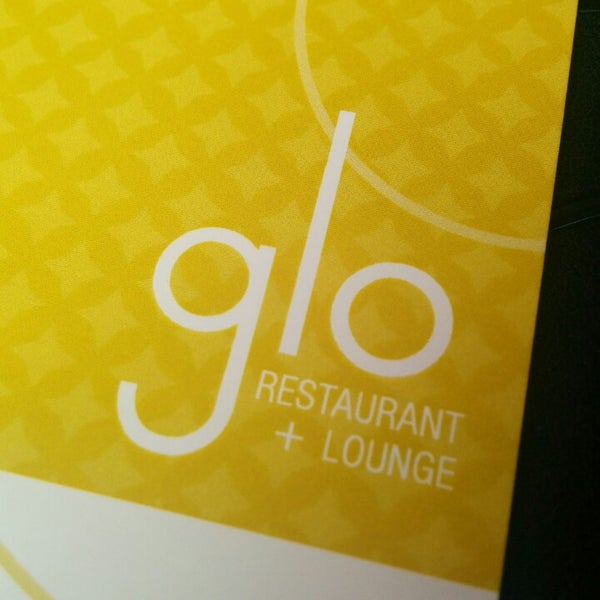 Photo taken at Glo Restaurant &amp; Lounge by Rebeca M. on 12/1/2013