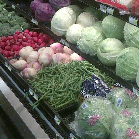 Photo taken at Uptown Grocery Co. by Abdul B. on 1/16/2013