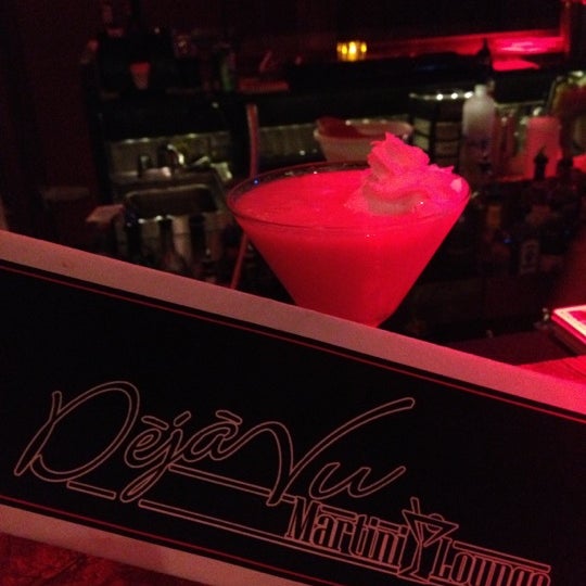 Photo taken at Deja Vu Martini Lounge by Chris H. on 8/25/2013