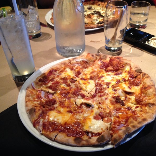 Photo taken at Napa Wood Fired Pizzeria by Suzanne X. on 4/3/2014