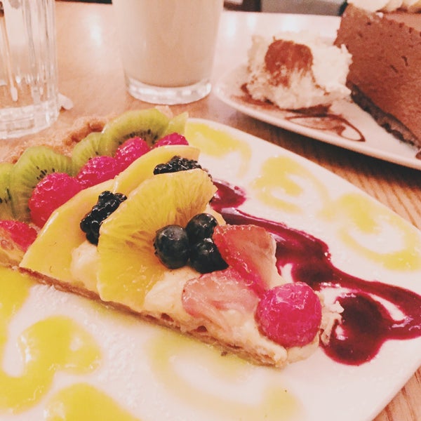 Fruit tart & chocolate moose cake with a glass of milk on the side. Yes please!