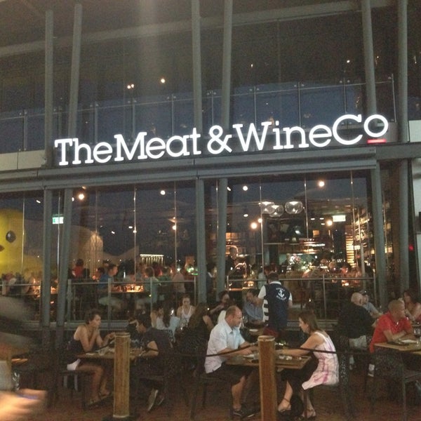 Photo taken at The Meat &amp; Wine Co by Reuben T. on 1/7/2013