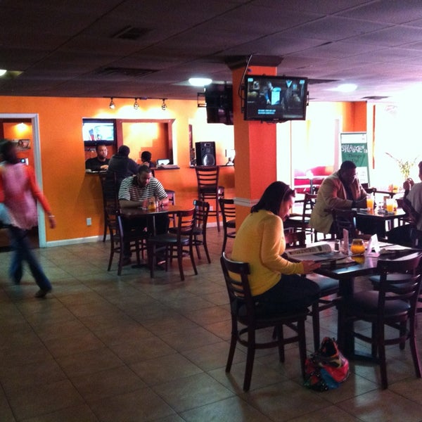 Photo taken at Mangos Caribbean Restaurant by TGongaware on 2/15/2013