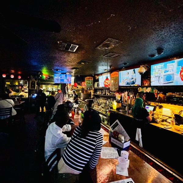 Photo taken at The Jimani Lounge &amp; Restaurant by Sean M. on 10/26/2022