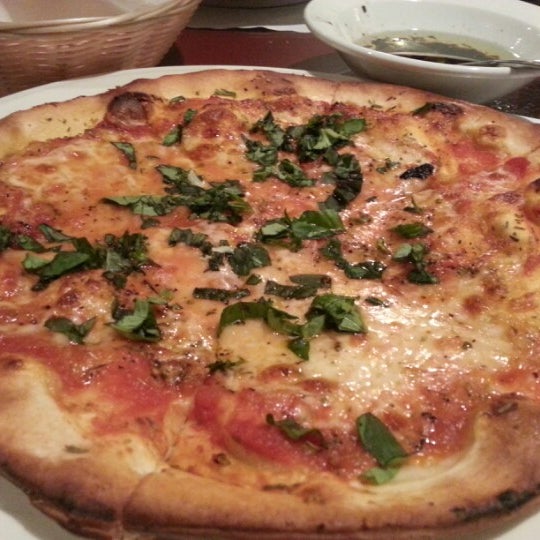 Photo taken at Tullio&#39;s Italian Restaurant by Tina L. on 1/5/2013