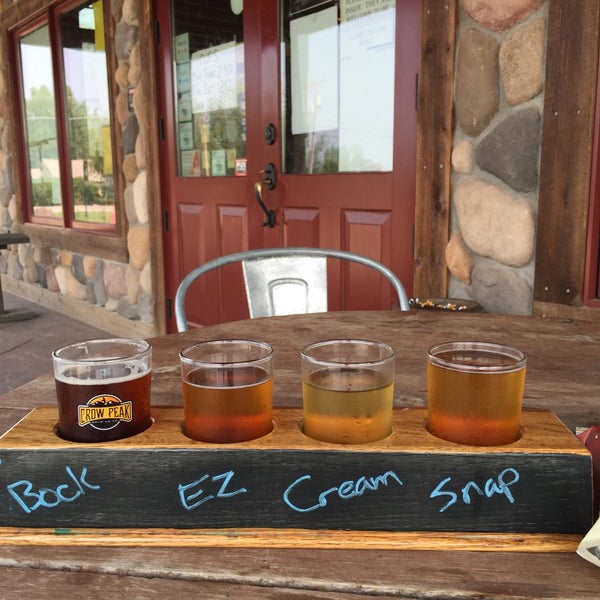 Photo taken at Crow Peak Brewing Company by Carmen T. on 8/21/2015