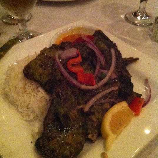 Photo taken at Rasoi Restaurant by Chris M. on 10/20/2012