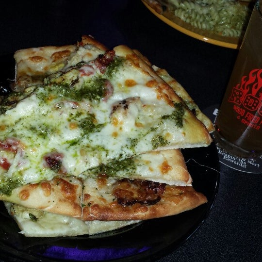 Photo taken at The Rock Wood Fired Pizza by Alex C. on 12/26/2013