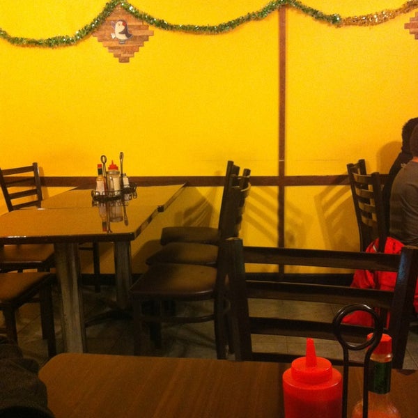 Photo taken at Mi Pequeño El Salvador Restaurant by Rosie S. on 12/26/2012