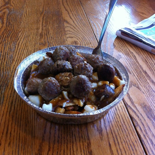 Photo taken at 514 Poutine by Tony G. on 6/14/2012