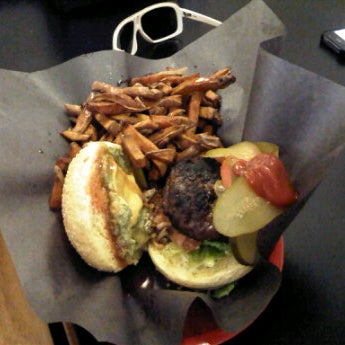 Foto scattata a Woody&#39;s Burgers bar and grill da Kyle G. il 4/22/2012
