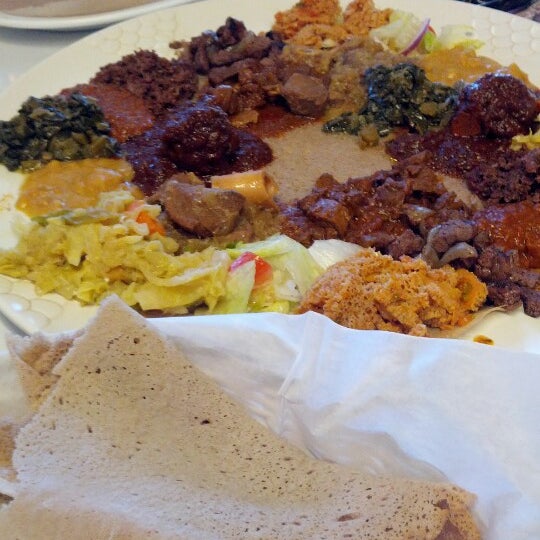 Photo taken at Messob Ethiopian Restaurant by Sally C. on 7/7/2012