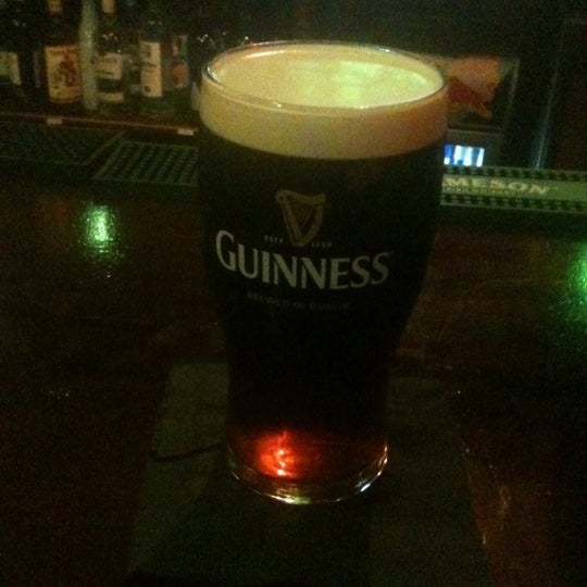 Photo taken at Slainte Irish Pub + Kitchen by Bip C. on 4/19/2012