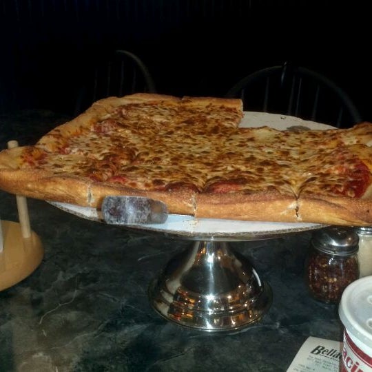 Photo taken at Bellacino&#39;s Pizza &amp; Grinders by Ted Y. on 5/19/2012