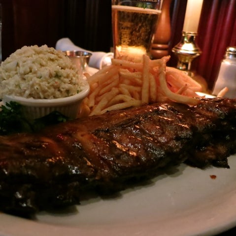 Photo taken at Bâton Rouge Steakhouse &amp; Bar by Rene N. on 6/27/2012