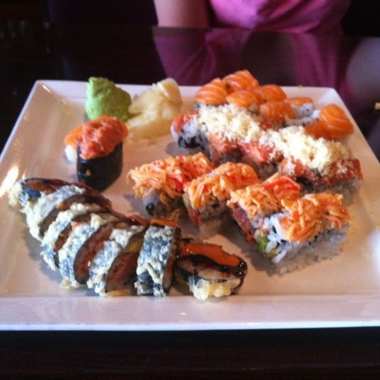 Photo taken at Sushi Kingdom by Michelle O. on 4/21/2012