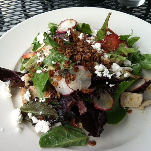 Outdoor seating, strawberry salad. Life is good here!