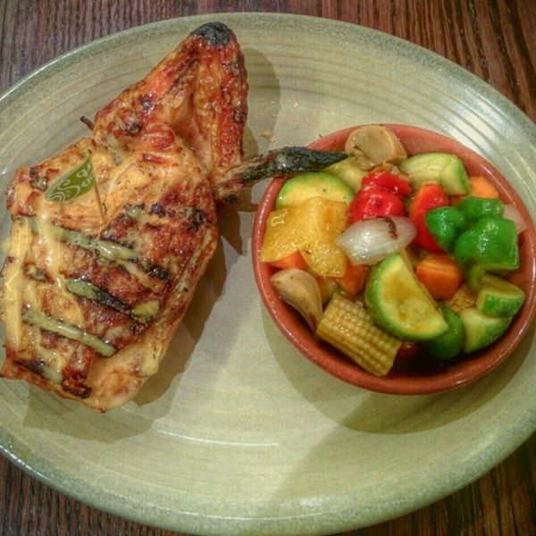 Photo taken at Nando&#39;s Zayed Town by Redha A. on 12/21/2015
