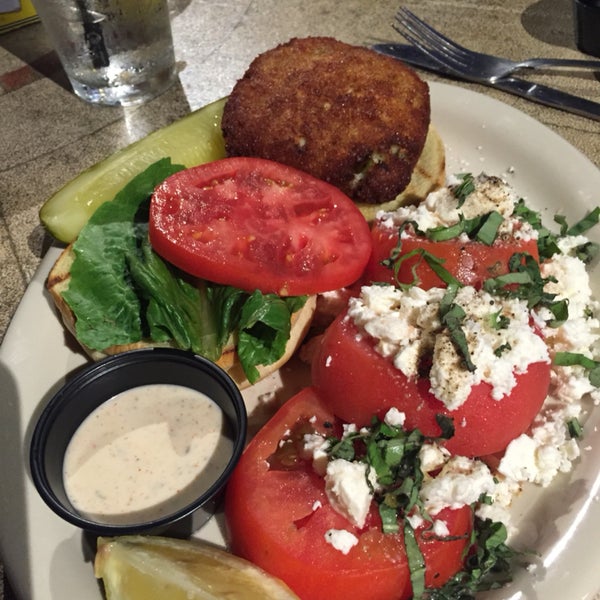 Yummy fried crab cake with tomato feta on the side.