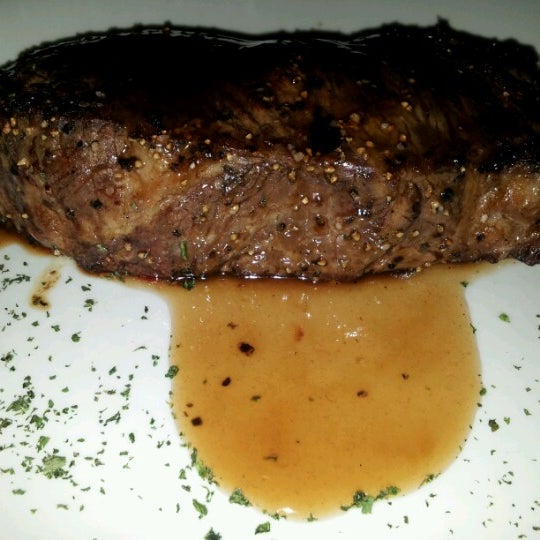 Photo taken at Sullivan&#39;s Steakhouse by M L. on 12/10/2012