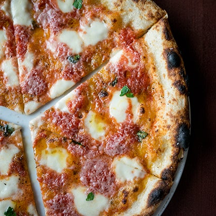 Start with the benchmark-setting margherita di bufala, but explore the rest of the menu, too. If a margherita pie and a New York pie had a baby, the Nana’s would be the result.