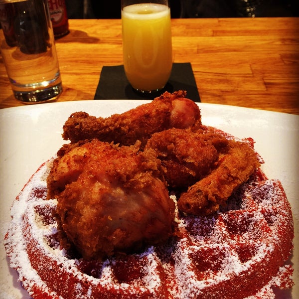 Amazing fried chicken and red velvet waffles and bottomless mimosas. Every time your glass of mimosa is less than full, someone comes by and refills it. Make reservations. This place gets busy.