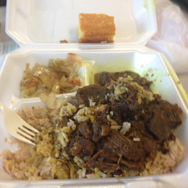 Order the curry goat with cabbage, rice & peas.