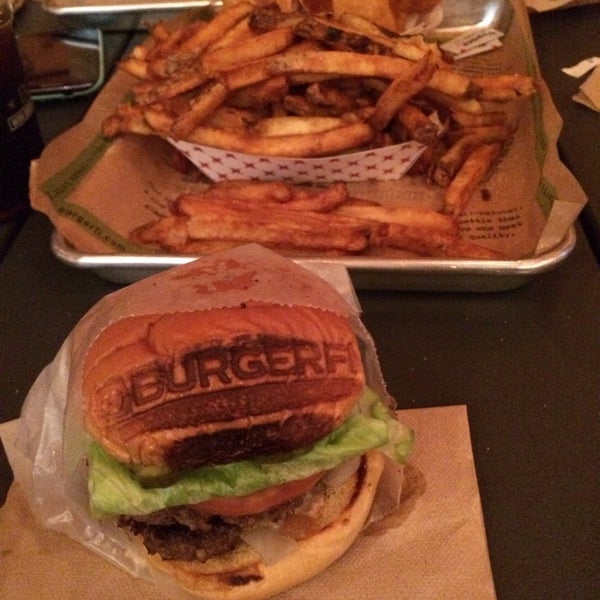 Photo taken at BurgerFi by Julie G. on 3/16/2014