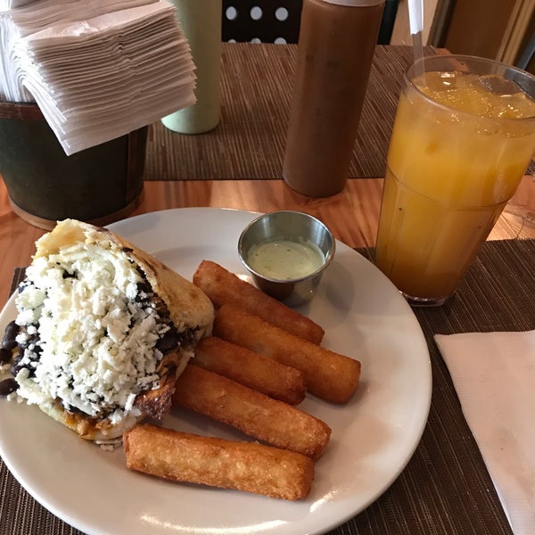 Photo taken at Arepas Cafe by Samuel B. on 2/1/2018