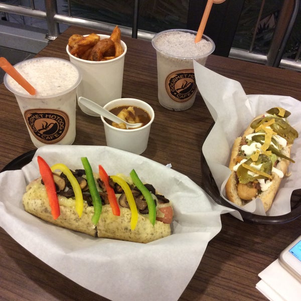 Photo taken at Gourmet Hotdog Cafe by Nisandra H. on 2/6/2015