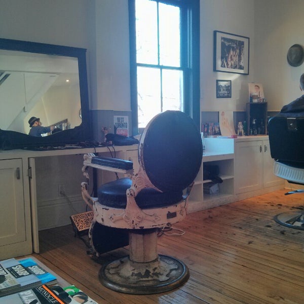Photo taken at Garrison&#39;s by the park Barbershop by Topher B. on 2/22/2014