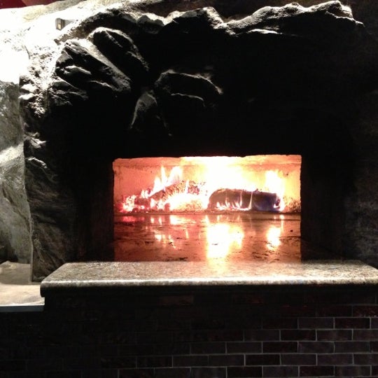 Photo taken at Tuscan Stone Pizza by John W. on 10/27/2012