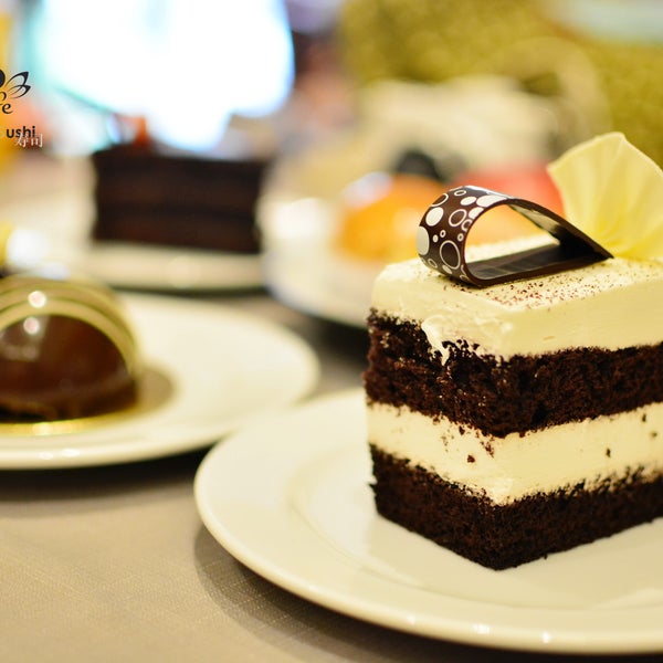 “Life is short, so eat dessert first” White Chocolate Mousse Cake, available only at Coco’s Café and Le Boulanger!