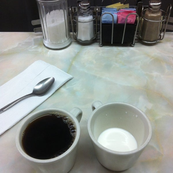 Photo taken at Donut Gallery Diner by Vic on 3/7/2013
