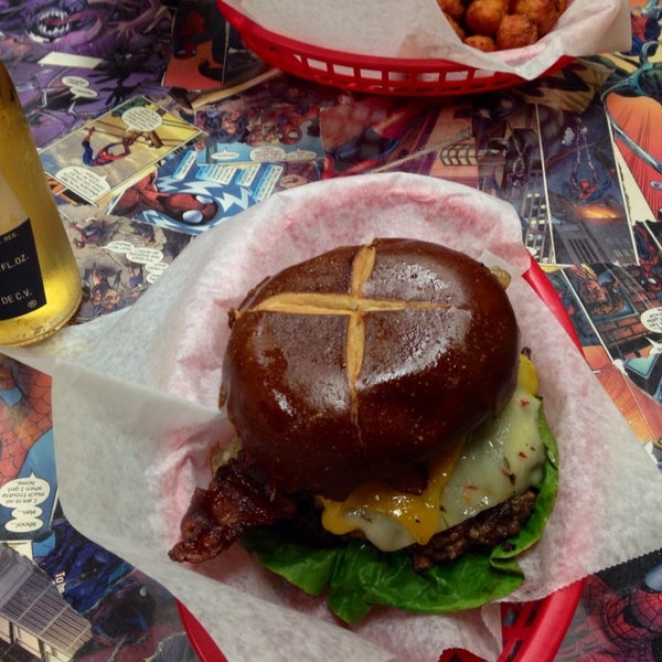 Photo taken at Action Burger by Joanna on 8/2/2014