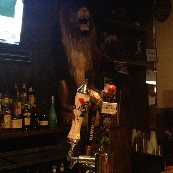 Photo taken at The Lion&#39;s Den Pub and Grill by Katrina J. on 4/2/2013