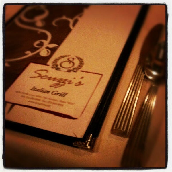 Photo taken at Scuzzi&#39;s Italian Restaurant by Bradley E. on 12/20/2012