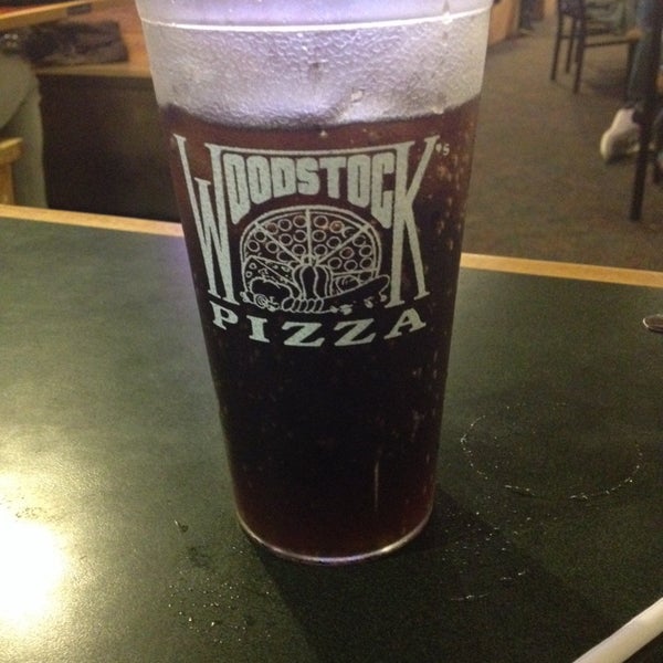 Photo taken at Woodstock&#39;s Pizza by Erin B. on 9/21/2013
