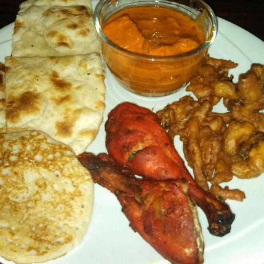 Photo taken at India Masala Bar &amp; Grill by Movie L. on 12/26/2013
