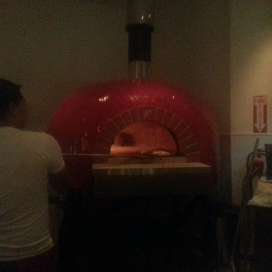 Photo taken at Angelina&#39;s Pizzeria Napoletana by Michael Sean W. on 12/23/2012
