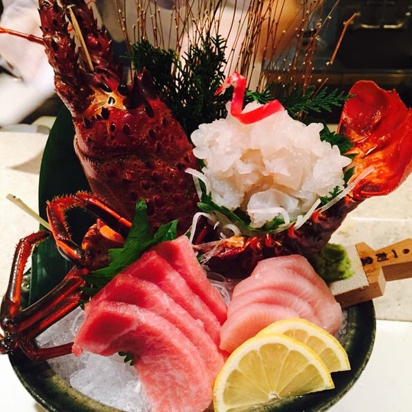 Photo taken at Sushi Zen by YoonJung P. on 1/7/2015