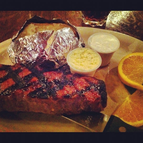 Photo taken at Black Bart&#39;s Steakhouse by Daniela J. on 10/18/2012