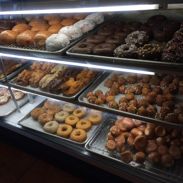 Photo taken at Surfin Donuts by Grace on 8/10/2014