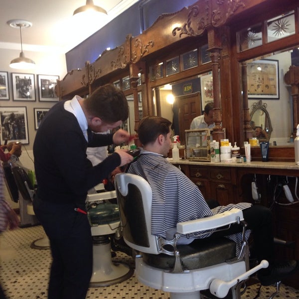 Photo taken at Neighborhood Cut and Shave Barber Shop by Bobby A. on 5/2/2014