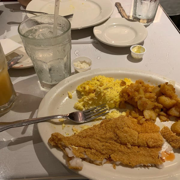 Photo taken at Sylvia&#39;s Restaurant by Gabby E. on 8/1/2019