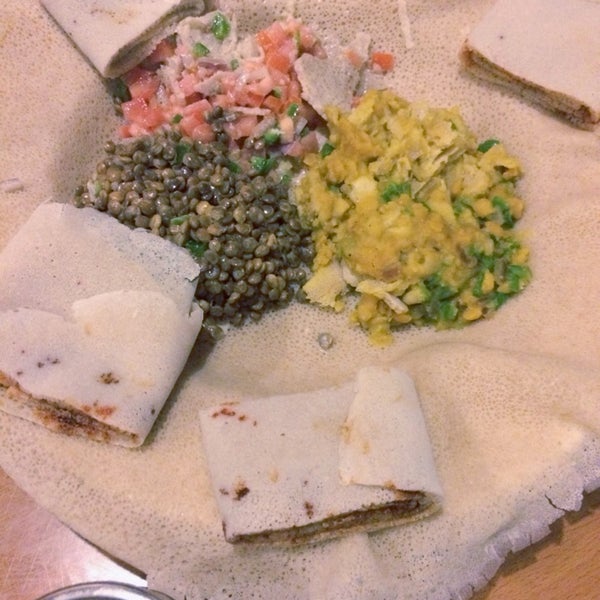 Photo taken at Lalibela Ethiopian Restaurant by Maggie P. on 2/13/2014