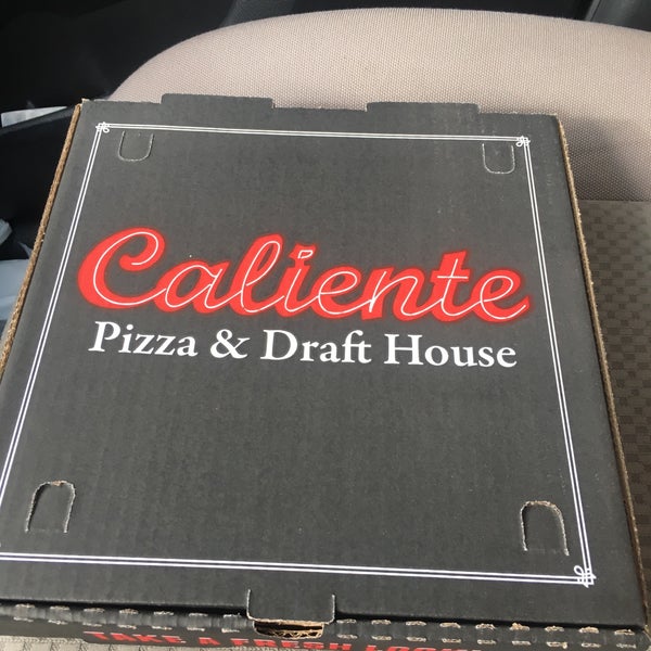 Photo taken at Caliente Pizza &amp; Drafthouse by Jennifer S. on 3/11/2017