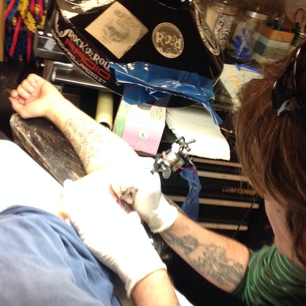 Photo taken at Rising Dragon Tattoos by Grant P. on 9/18/2013