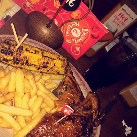Photo taken at Nando&#39;s by S on 5/15/2014